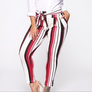 Red, black, and white striped dress pants